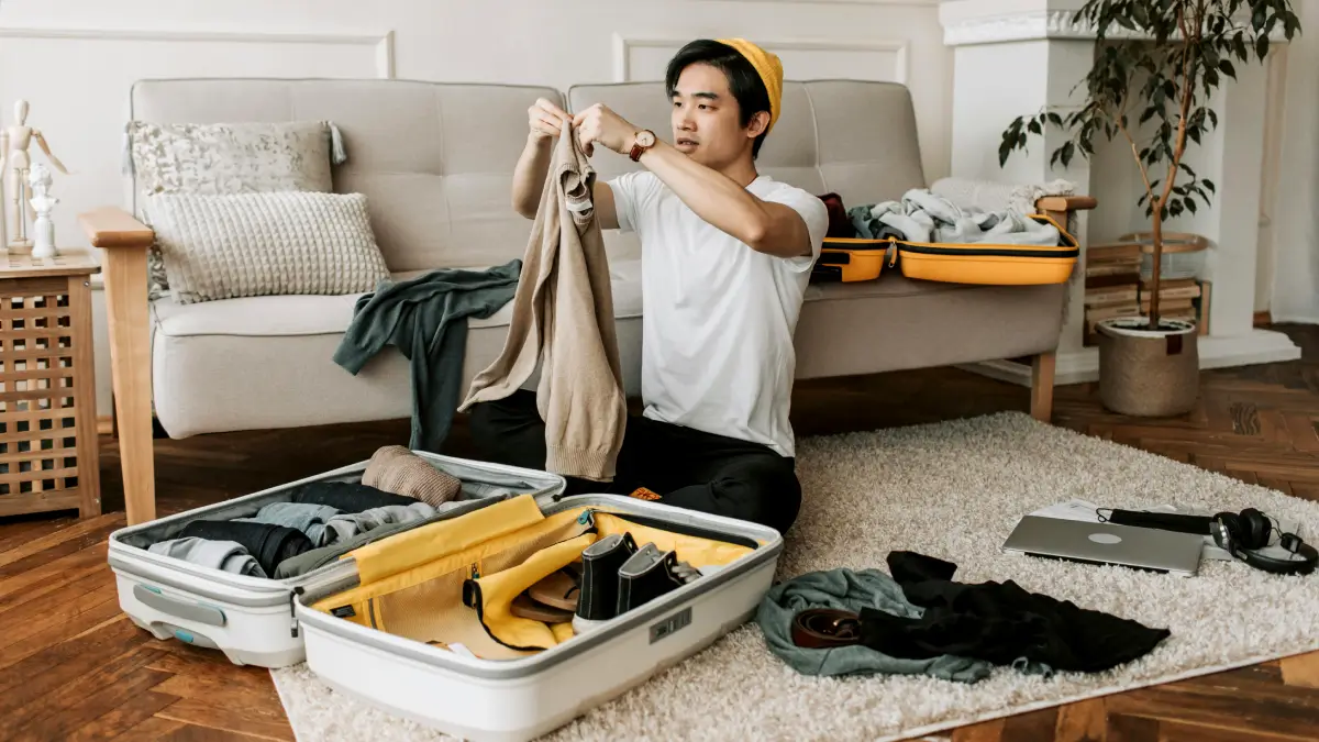 a person packing size of luggage for a 2-week trip